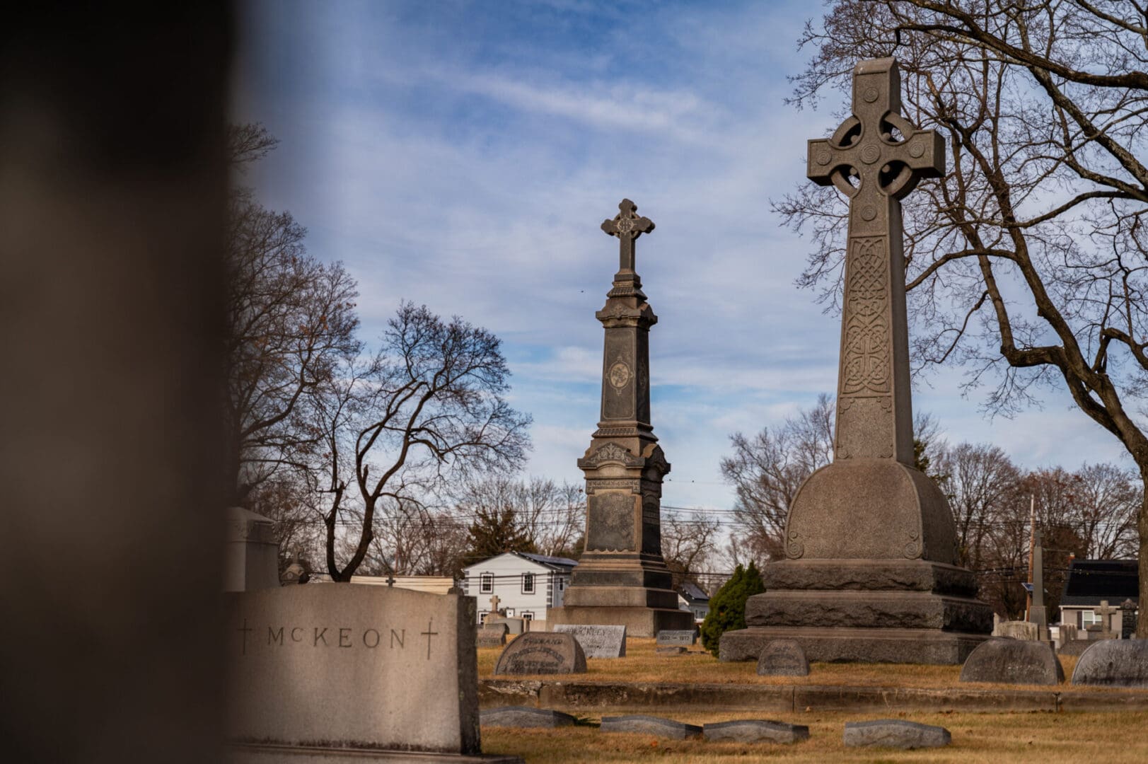 Gravestones with Celtic crosses in cemetery.