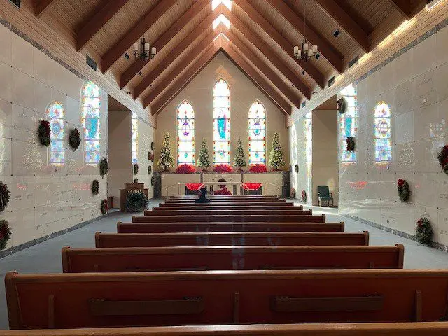 Interior of a decorated church during Christmas.